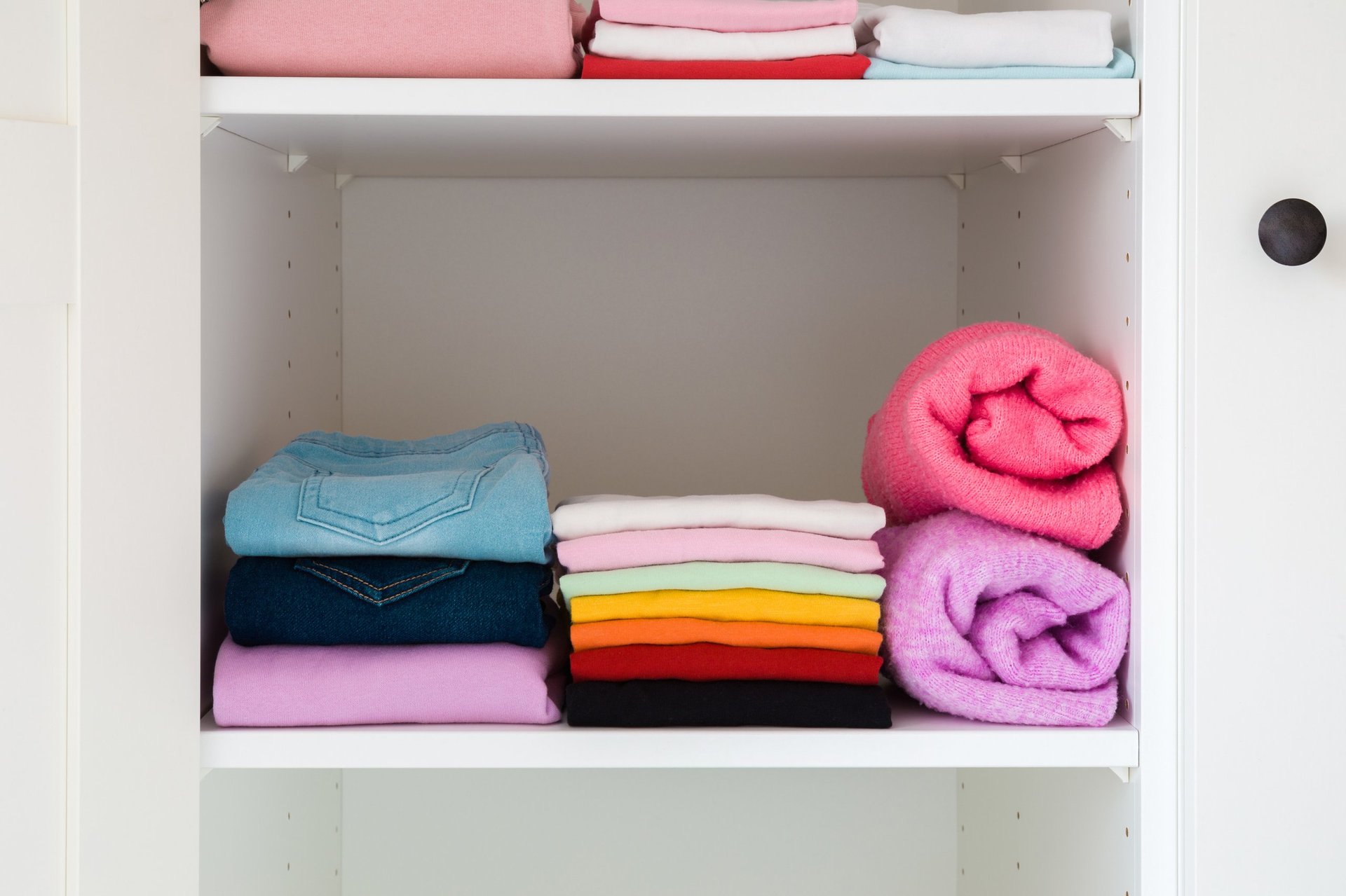 Folded colorful apparel neatly stacked in a store display
