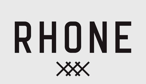 The word RHONE in black capital letters with a decorative cross-hatched symbol below it on a light gray background