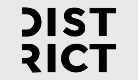 Black text reading DISTRICT stacked on a light gray background