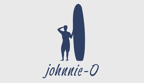 Silhouette of surfer holding surfboard with Johnnie-O logo text below